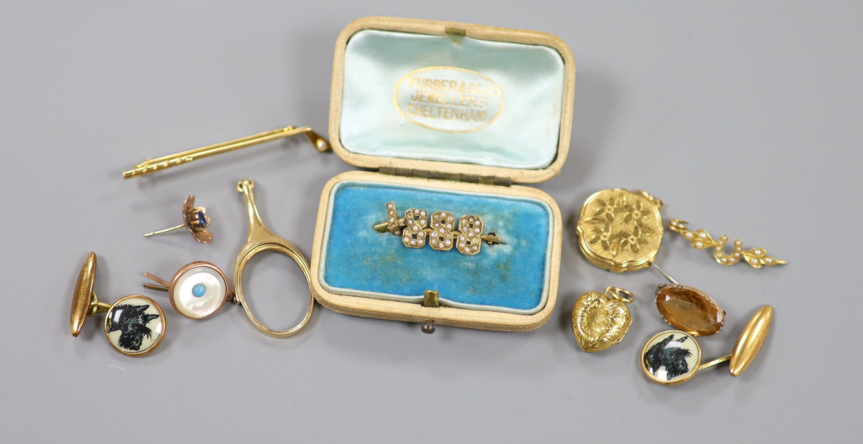 A modern engraved 9ct gold circular locket, gross 4.6 grams a 15ct and seed pearl set golf club bar brooch, gross 2.8 grams and other minor jewellery.
